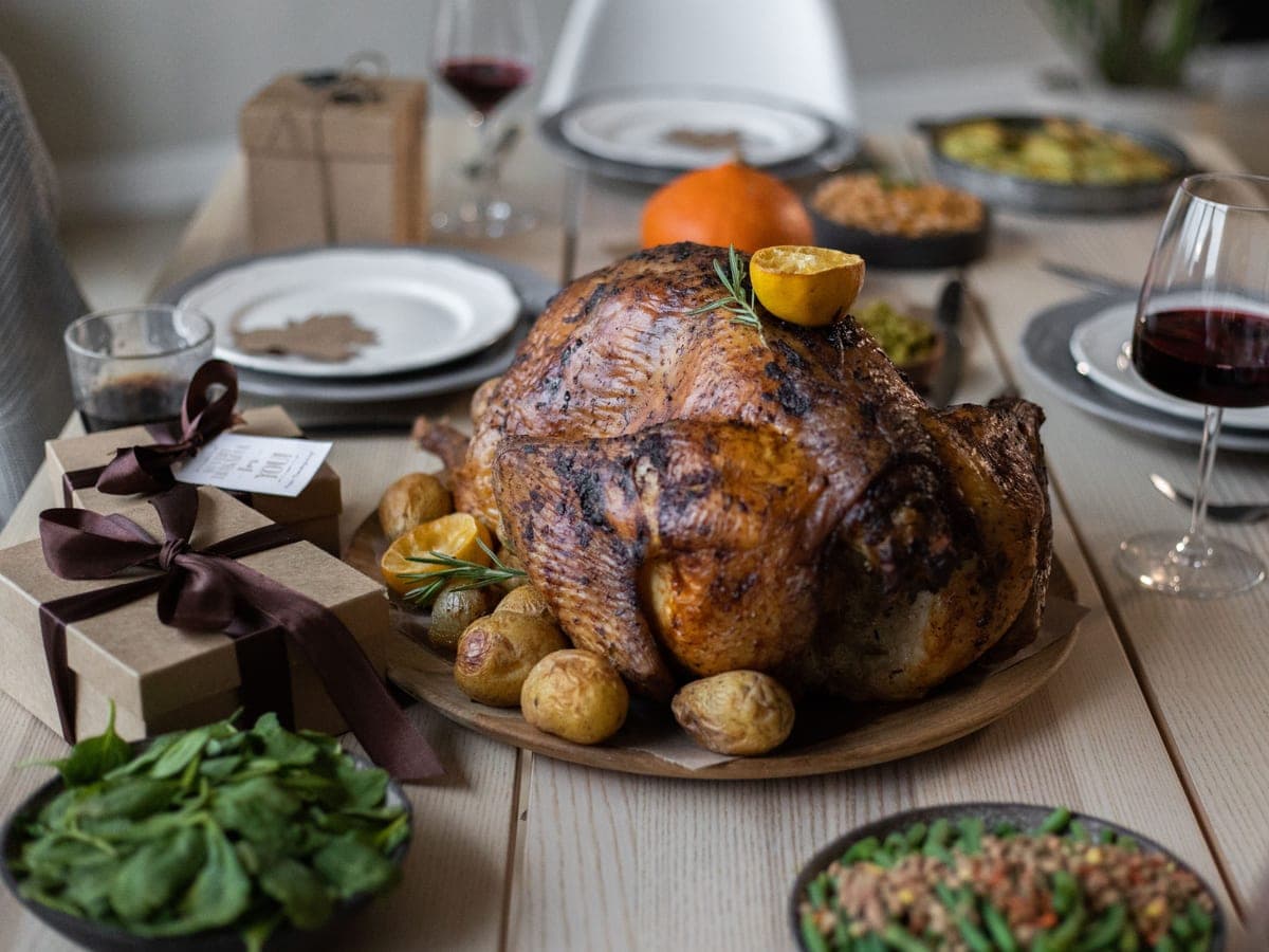 A roasted turkey on a set holiday table — Fryer & Feast, thanksgiving & holiday hosting gear