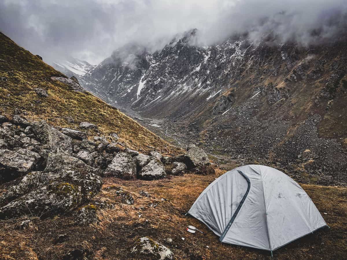 A lightweight tent pitched in a rocky mountain valley — Ounce & Outlook, backpacking & ultralight gear